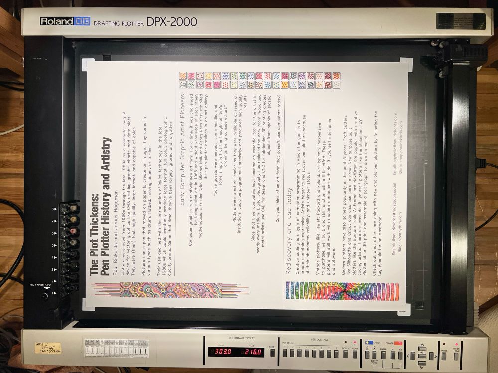 A Roland DPX 2000 pen plotter with a completed poster titled The Plot Thickens: Pen Plotter History and Artistry. 