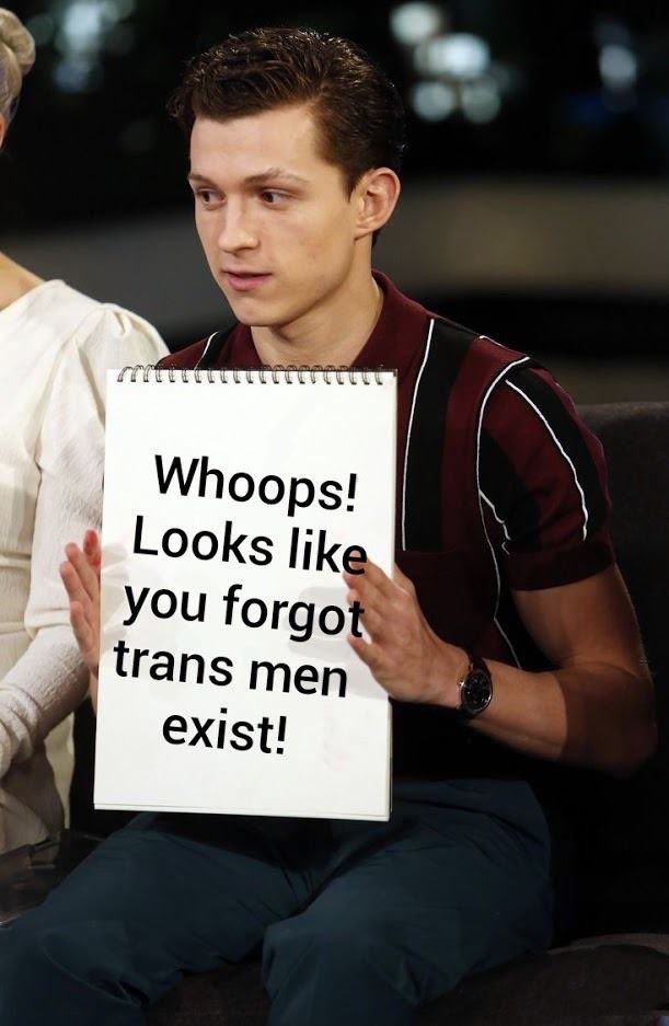 Tom Holland holding up a sign photoshopped to read “whoops! Looks like you forgot trans men exist!”