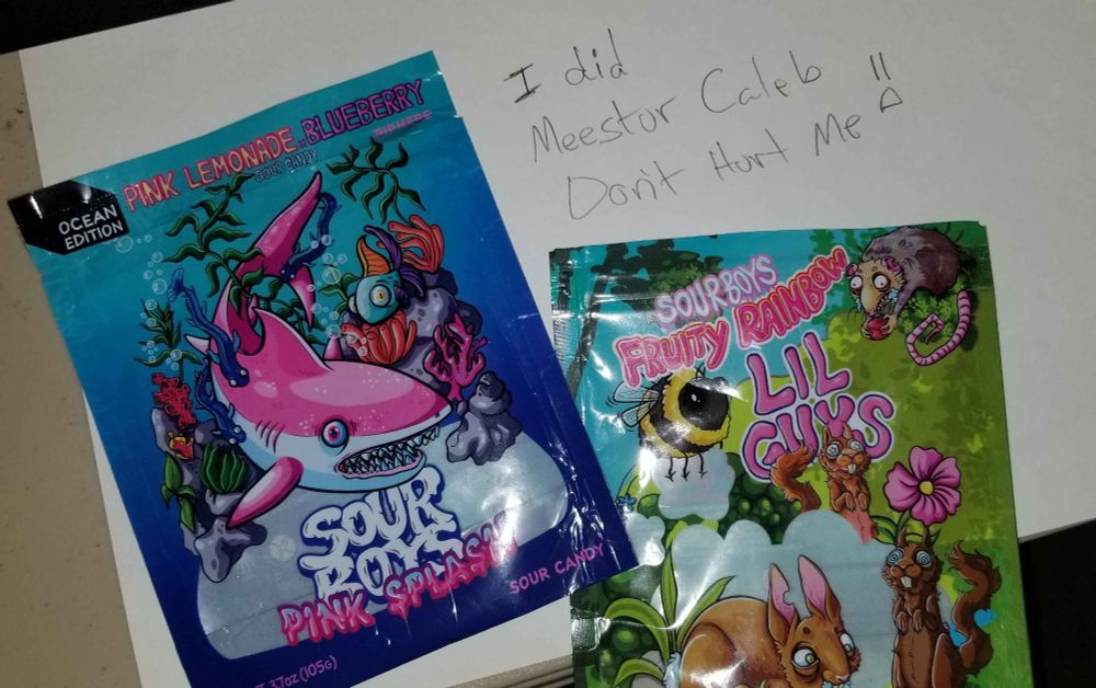 An image of two empty candy bags from the Sour Boys brand of candy made by the youtuber Oompaville. Supplied in the hopes that his terrible gaze does not smite me where I stand.