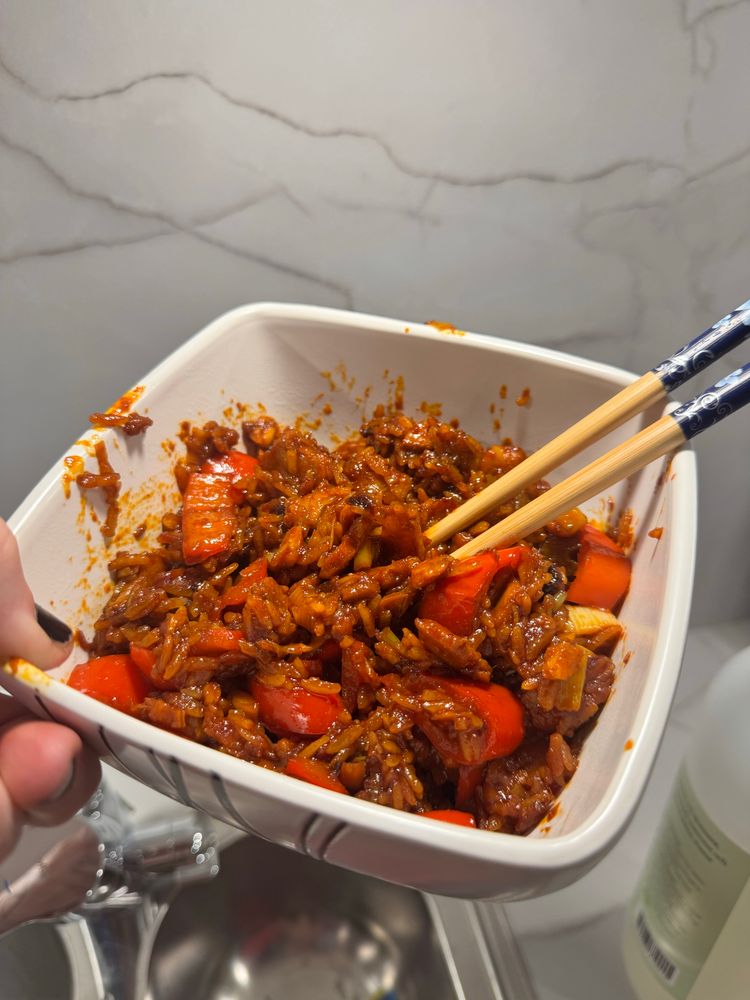 Fried rice, red, in a white bowl