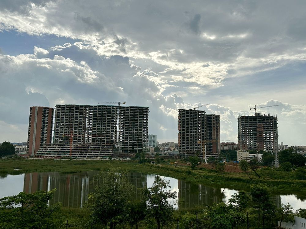 Image of construction site by a lake in Bengaluru, India.