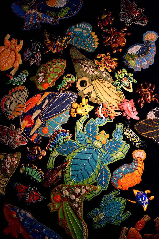 A picture of some of the trinkets you can find in my shop.
These are polymer clay pins and embroidered patches.

Almost all of these are bugs such as tree hoppers, butterflies and beetles

key words: art , embroidery , handmade 