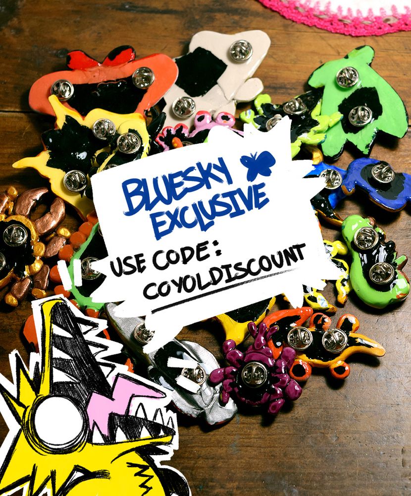 A pic of my fursona talking about the promo in the post, theres a pic of the back of my pins in the background