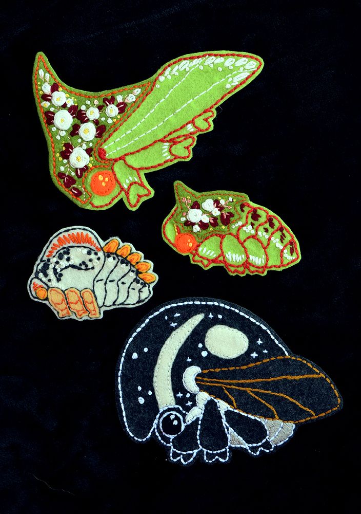 A bunch of embroidered patches. They were made in felt fabric.
They are two pairs of tree hoppers, adult and baby stages.

I was trying to go accurate at first, but I liked adding cute patterns to them later whoops