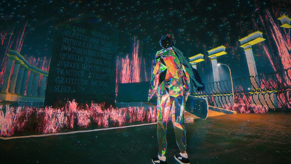 A screenshot from Skate Story. The world is abstract and vibrant. A skateboarder that is a demon made of glass stands in front of an obilisk that says "Please suffer silently and weep without us hearing, for this is the lowest of hells. Ponder the darker depths and practice utmost gratitude as you sleep."
