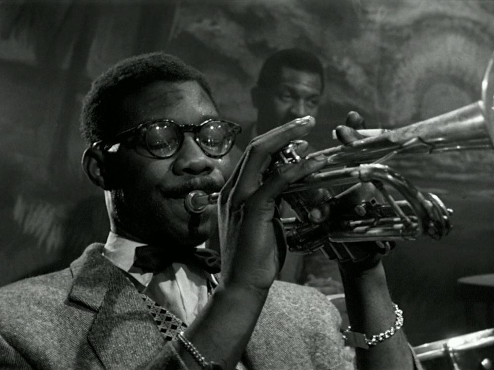 A black trumpet player from The Sleeping Tiger, shot in Black and White.