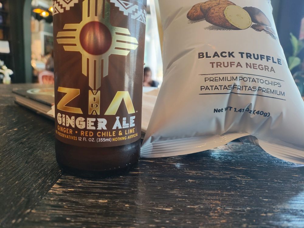 Photo of Zia Ginger Ale made with ginger, red chile and limes. Photo of black truffle potato chips. 