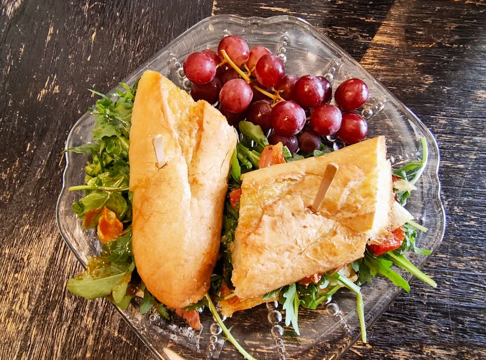 Photo of a Waka Waka ham sammich with red grapes
