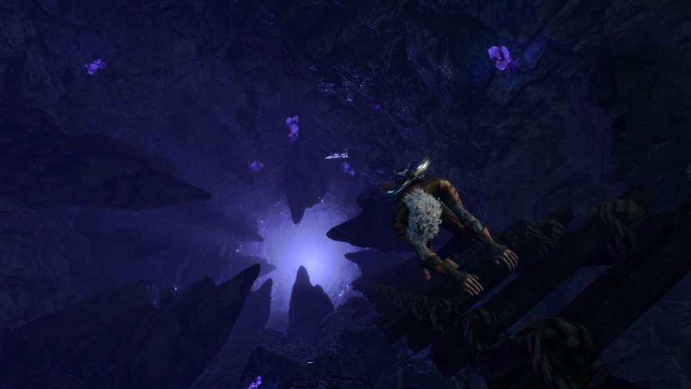 A screenshot from Baldur's gate 3 of a white haired Drow woman climbs down a ladder into a chamber lit by purple fungi and lined with jagged rocks.