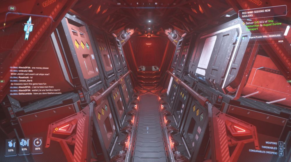 Screenshot from Star Citizen. The hold of a ship with storage boxes angled either side of a narrow walkway.