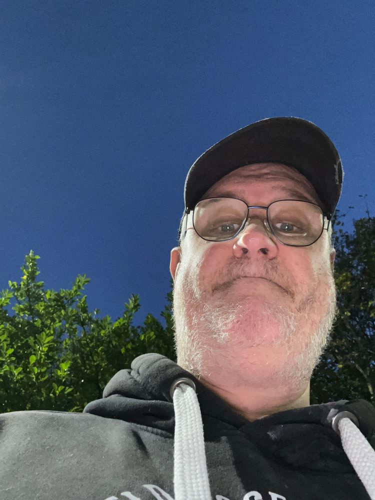 fat man under floodlights 