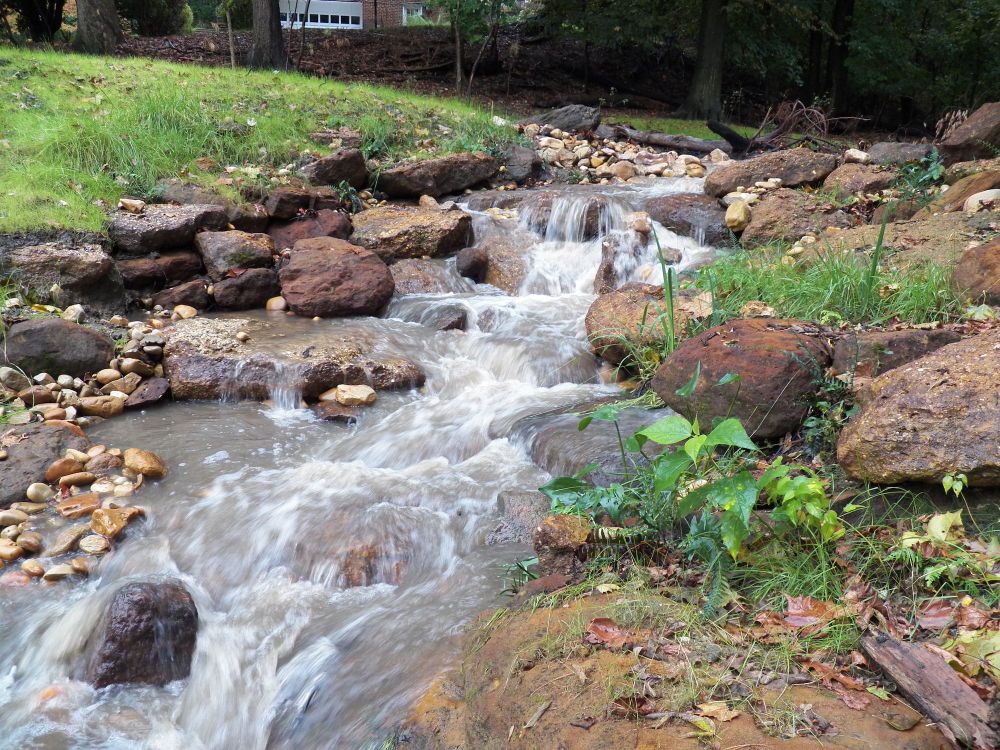 A national geographic photo of a stream running over some rocks