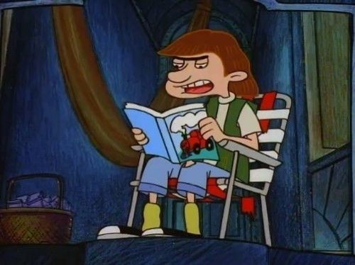 Stoop Kid from the television show Hey Arnold shown sitting on a lawn chair on his stoop reading a book or magazine with a train on the cover