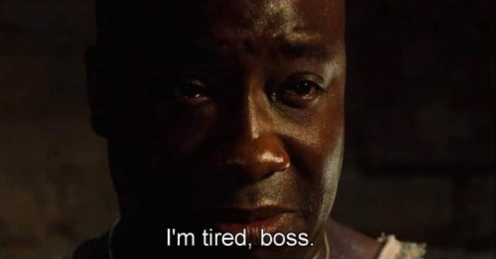 Still from the movie The Green Mile showing a sad looking John Coffey with text that reads "I'm tired, boss."