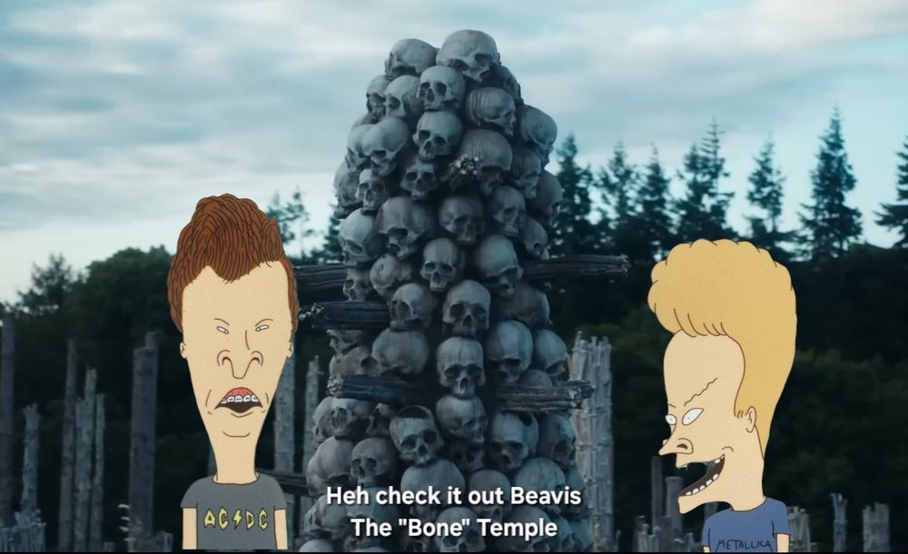 Beavis and Butt-head placed in front of the skull tower from the Bone temple in the movie 28 Years Later with text that reads "Heh check it out Beavis The 'Bone' Temple"