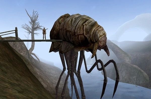 Silt Strider from morrowind. A large insect-like creature standing near a river with a ramp leading to it from a nearby hill. A humanoid figure stands on the ramp