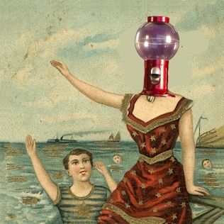 The cover for the album In the Aeroplane Over the Sea by the band Neutral Milk Motel but with the head of Tom Servo from MST3K over the head of the drum headed girl