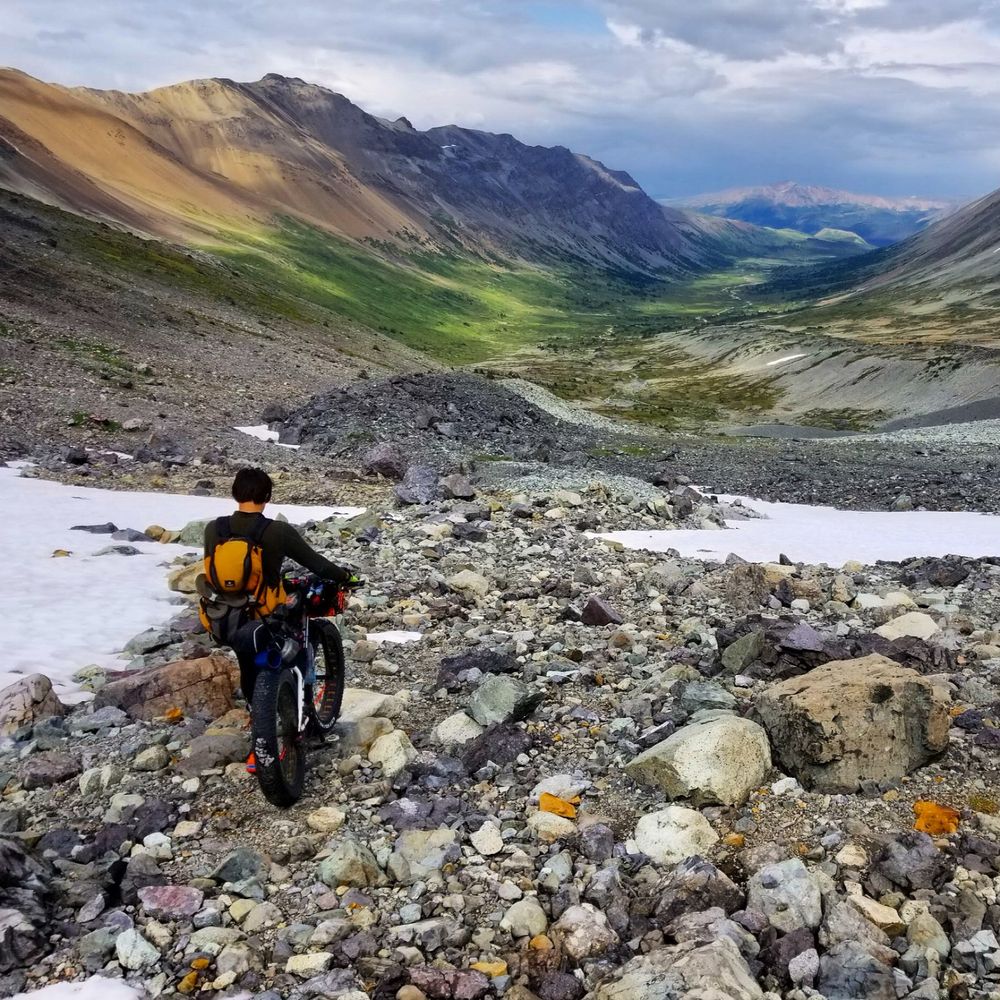 Myself with a fatbike staring down a high altitude valley in the Chilcotin mountains. 