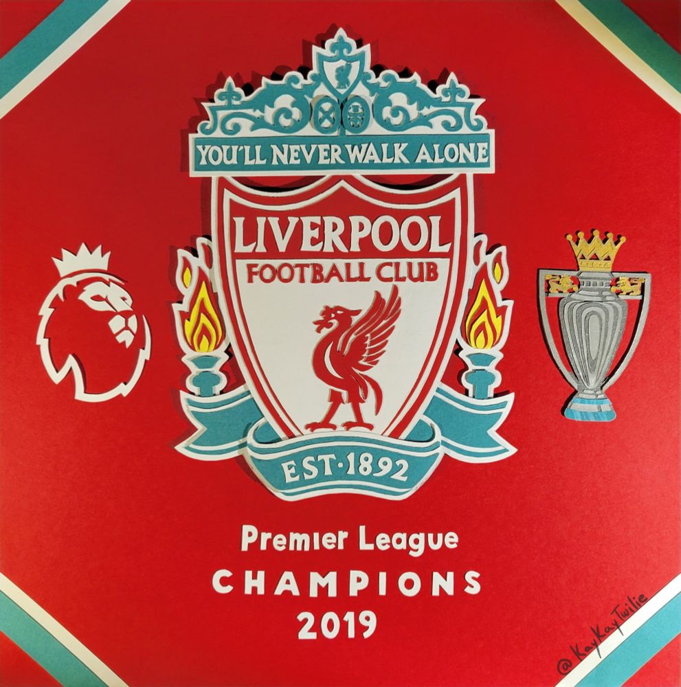 Different lighting to show the crest is not flat, but is 3 dimensional with the many layers of paper.