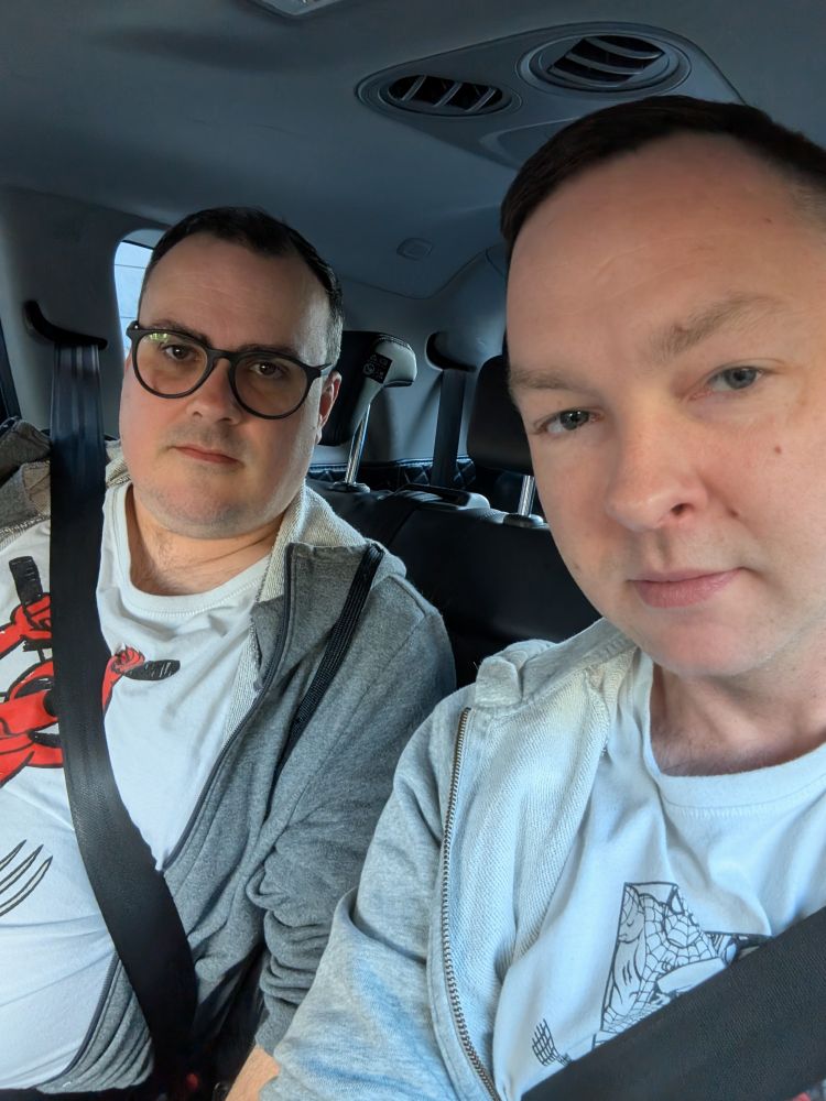 Two pissed off middle aged men in an Uber.