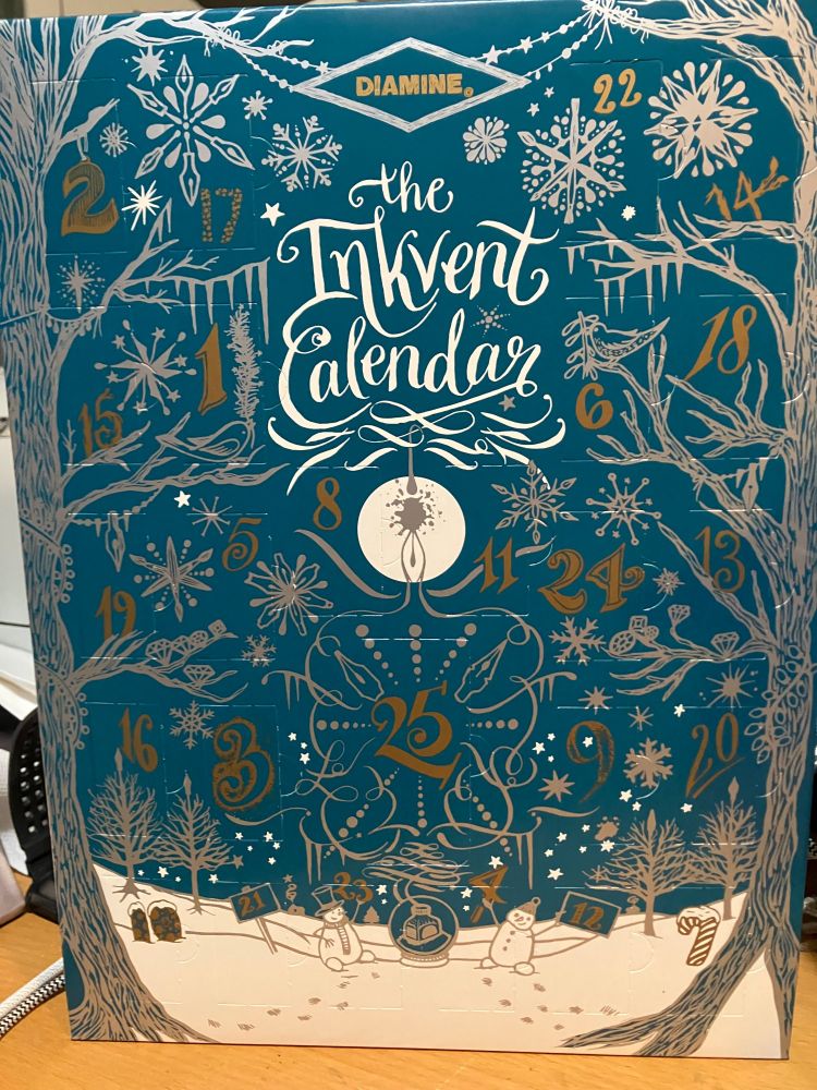 An advent calendar from the Diamine company. You can't see them in this photo, but each little numbered door opens to a small bottle of fountain pen ink in a limited-edition color.