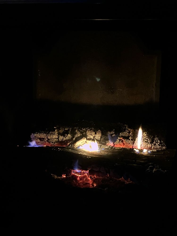 Close view of embers and flames in a fireplace