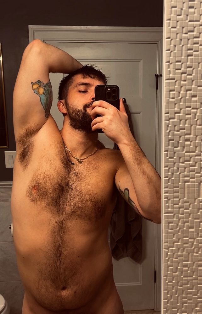 Bicep, triceps, tattoo, fur, smolder. Man stuns in new mirror selfie photo after a shower!