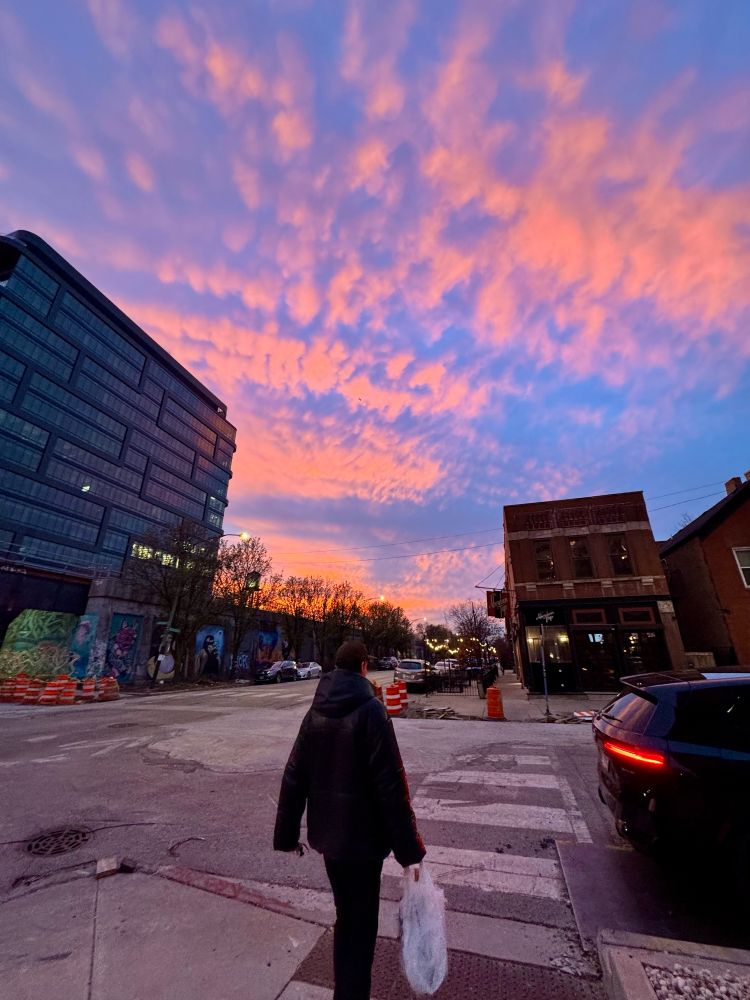 Image of a road with sunset pink and blue colors in the sky 