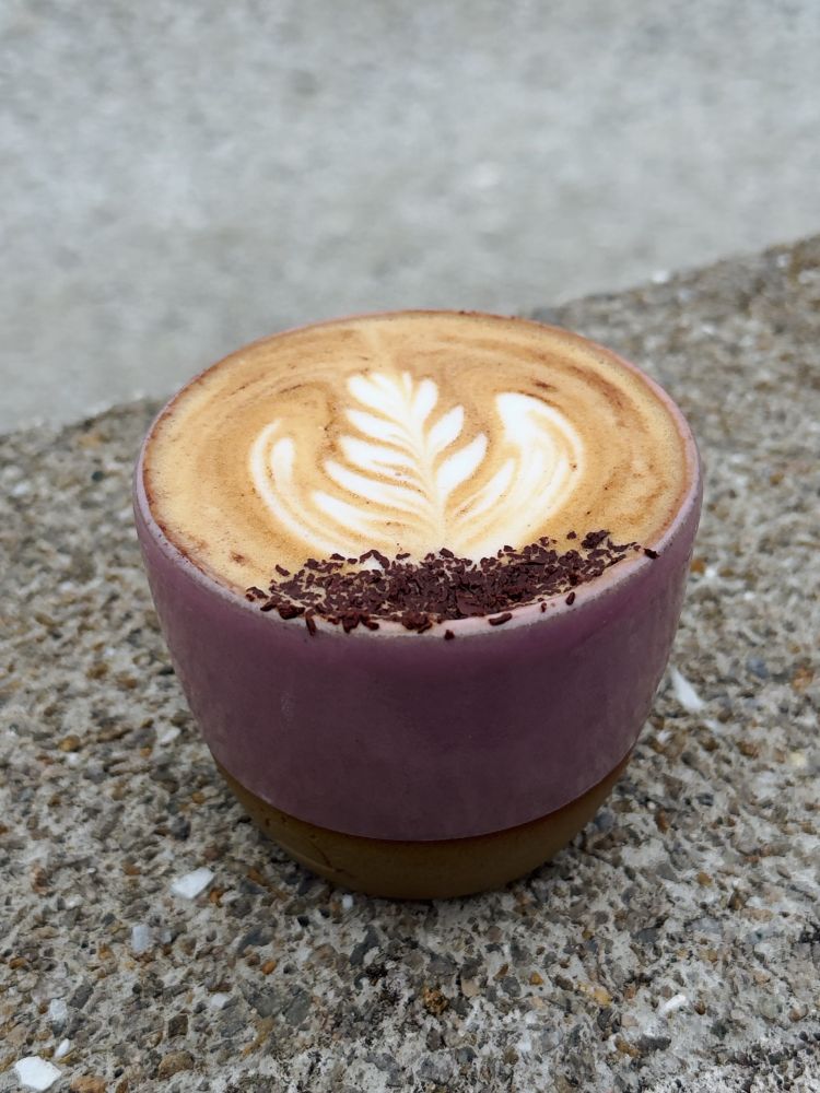Cup of cappuccino with latte art and chocolate shavings 