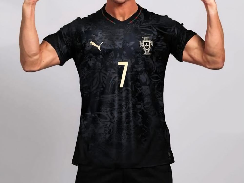 Black jersey with a black floral pattern and red and green trim on the collar