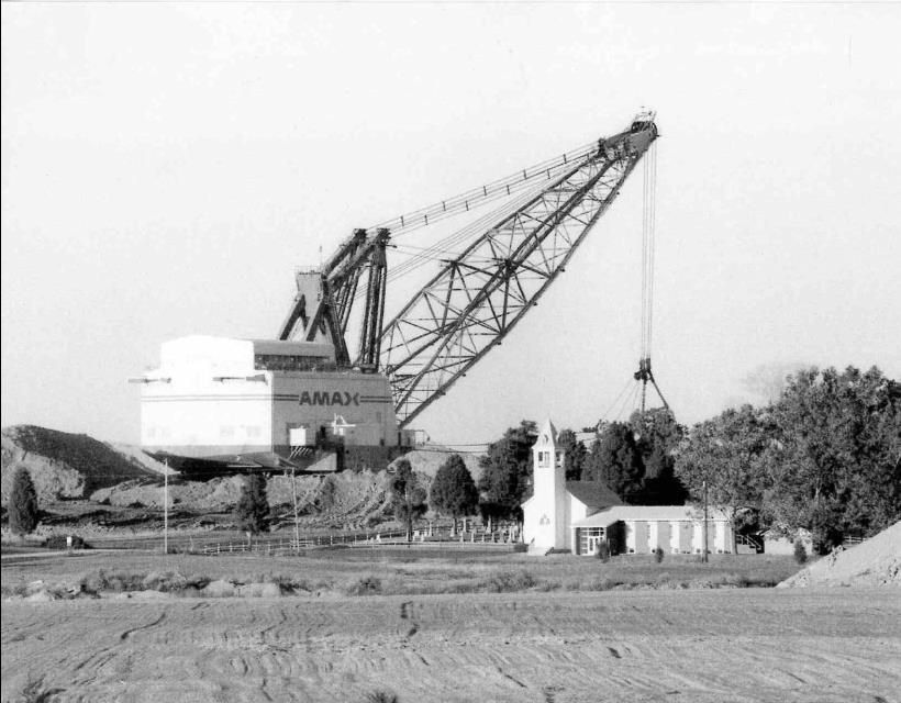 One of the largest draglines in Southern Indiana, towers over a nearby church. I thought this was B-E 3270W, but I believe it may be a Marion 8950.