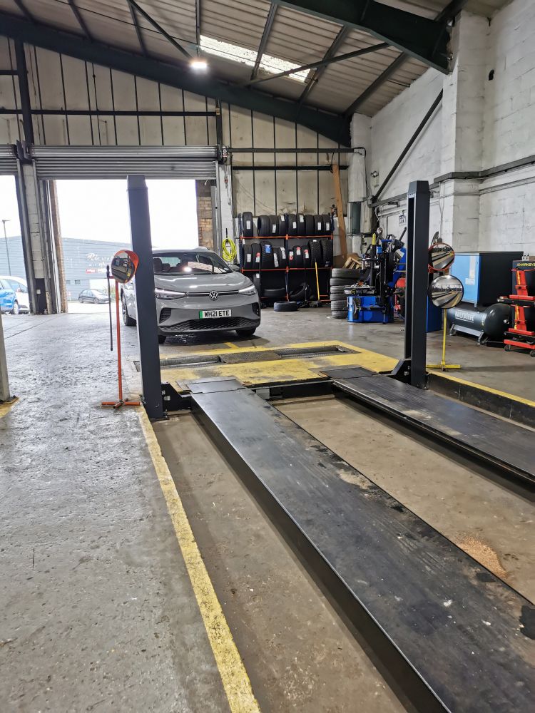 A Volkswagen ID4 in an MOT test lane