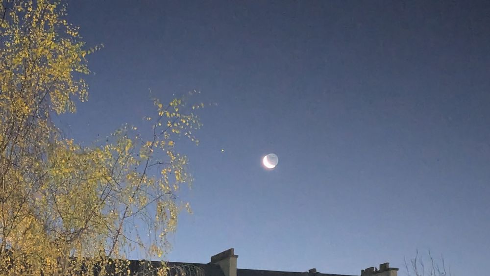 Crescent oon and morning star in the clear sky