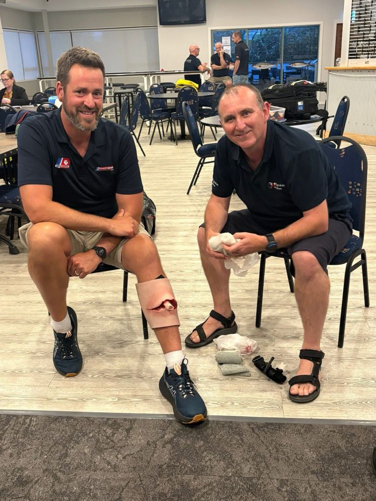 Kane Turner (KT Services) on the right with one of our volunteers on the left with a pretend injury to his leg - we discussed how to deal with certain injuries etc. 