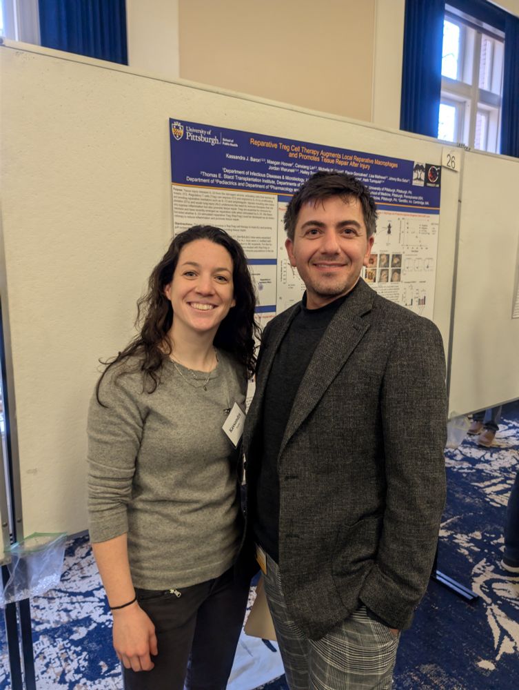 Dr. Faruk Sacirbegovic and Kassandra Baron posing in front of her poster presentation.
