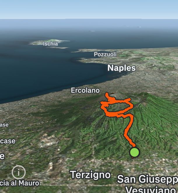 Aerial map view of Mount Vesuvius hiking route from Ercolano to Naples area, showing orange trail path with green start point marker and labeled Italian cities including Ischia, Pozzuoli, and Terzigno