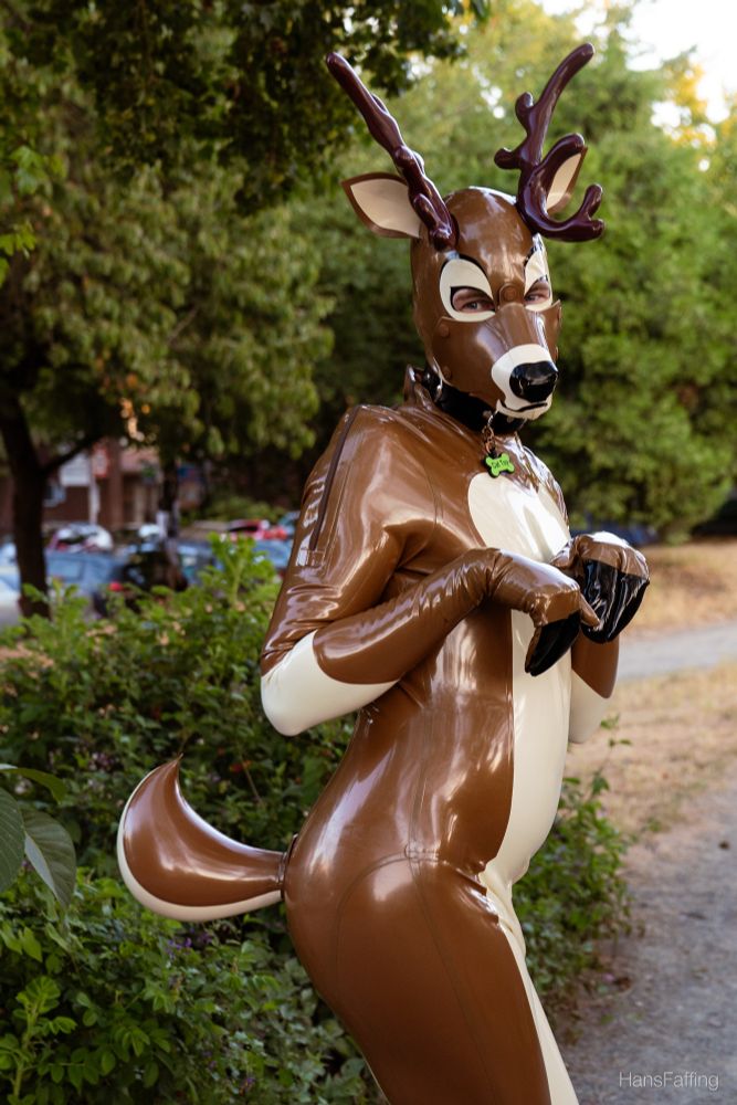 A gay little rubber deer in the park showing off his gay little rubber tail