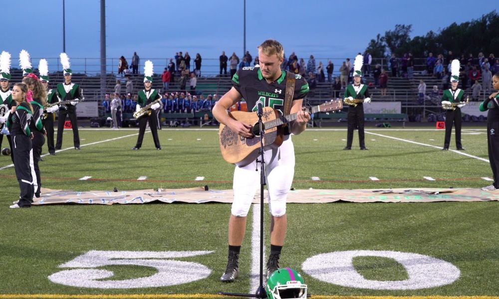 High School Football Star Stuns Crowd with Impromptu National Anthem Performance