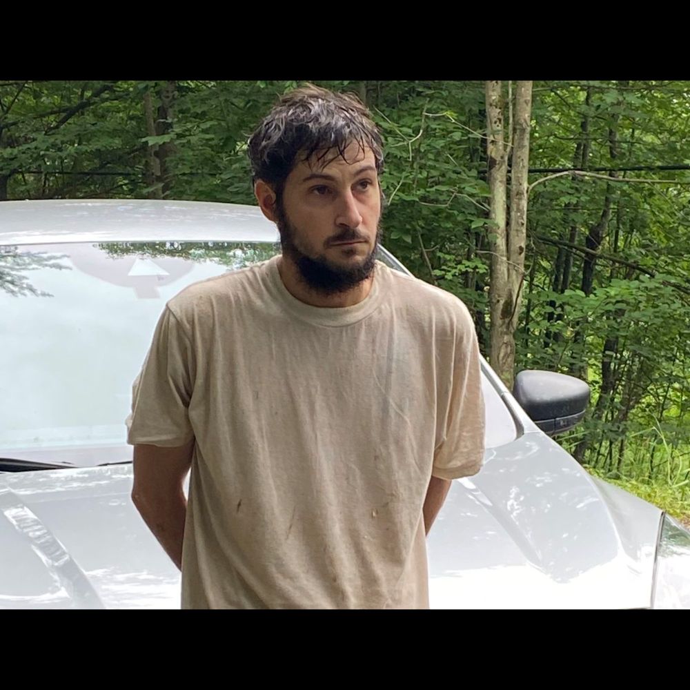 Escaped homicide suspect Michael Burham captured in wooded area in Warren County, state police say