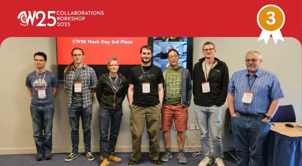 7 people posing in front of a screen reading “hackday 3rd place”