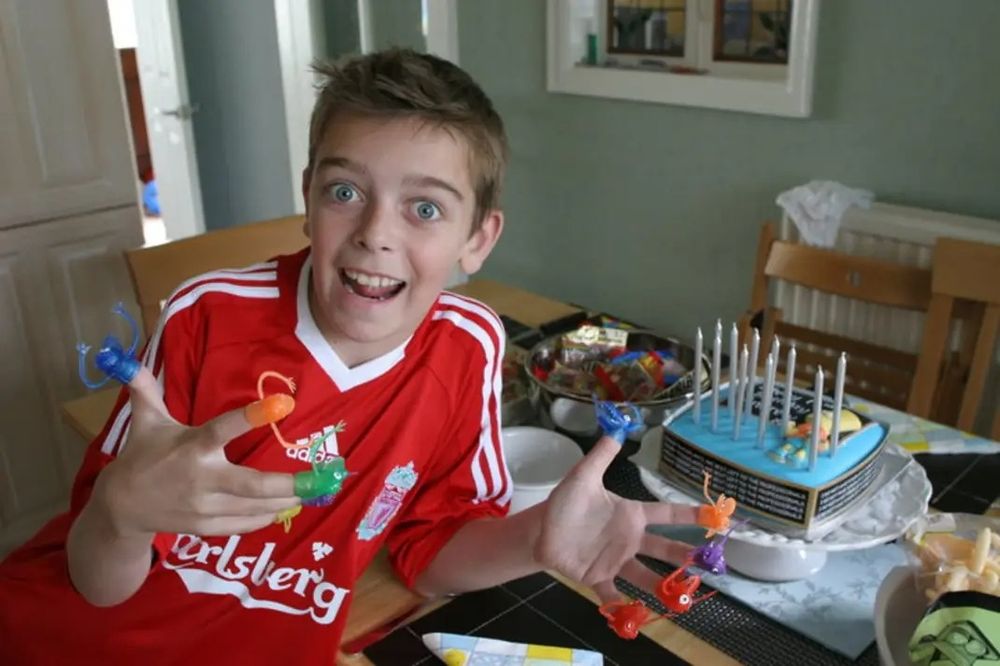 An old photo of me in the 2000s wearing an adidas Liverpool FC shirt 