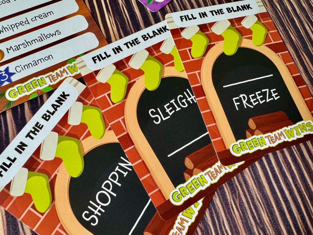 The fill in the blank cards from Green Team Wins Holiday Party. It's Shopping Blank (I'd say LIST), Sleigh Blank (I'd say RIDE), and Blank Freeze (I think I'd say DEEP). 