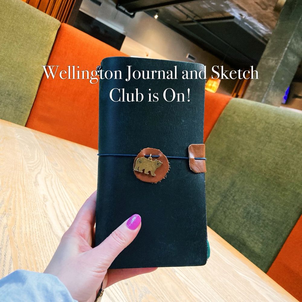 My journal at a cafe table