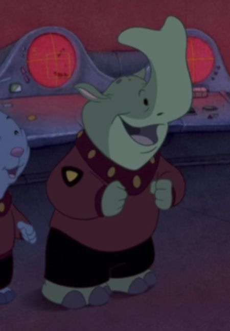 Cropped screenshot from Lilo and Stitch (2002), featuring an alien that looks like a bipedal green Embolotherium in a suit. He looks excited. He's just a little guy