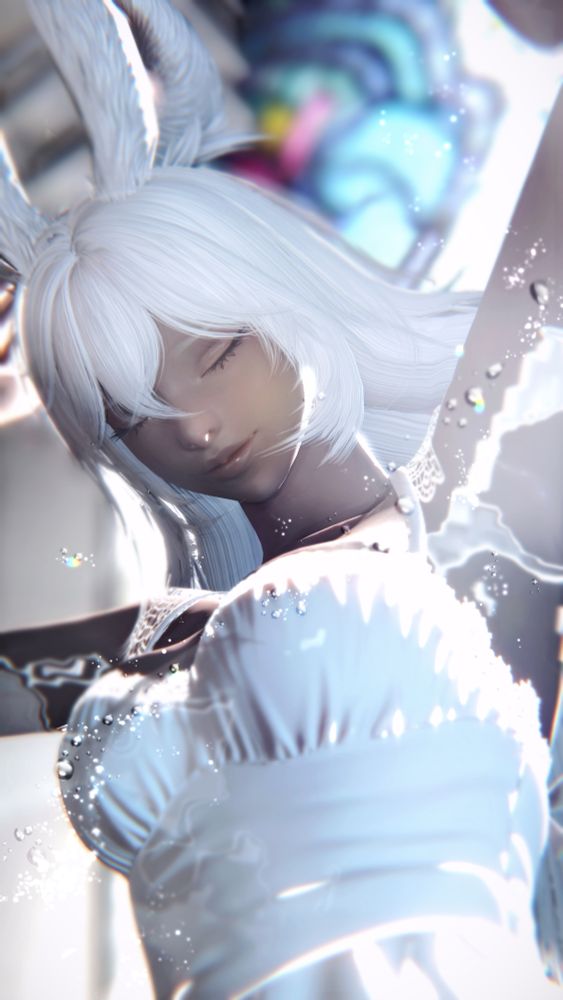 Worms eye view of Aura bathing in light with a peaceful expression on her face. Light illuminates her from the bottom left and right with a grey frontal light for balance.