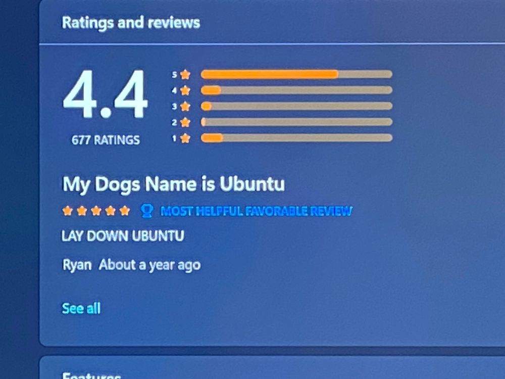 A user review of the Ubuntu distribution for Windows Subsystem for Linux (WSL). Review title: “My dogs name is Ubuntu”. Review text: “LAY DOWN UBUNTU”