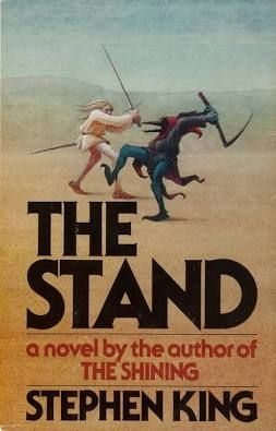 Two figures engaged in combat. The first, human, wields a sword, the second, crow like, wields a sickle. The words "The Stand" a novel by the author of the Shining. Stephen King
