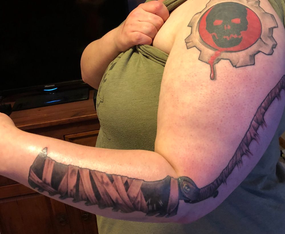 Saw cleaver weapon from video game Bloodborne on left arm. Pre transition photo sorry.