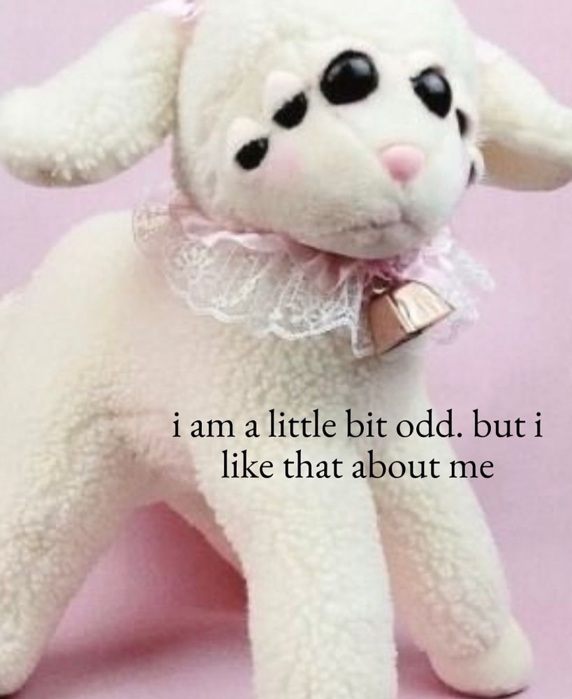 image: a lamb plush with many eyes
text: i am a little bit odd. but i like that about me 
