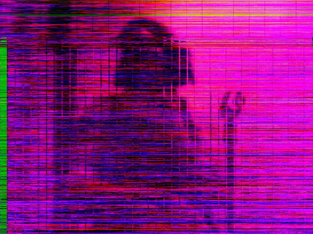 an image riddled with static that has a figure behind it, with a microphone